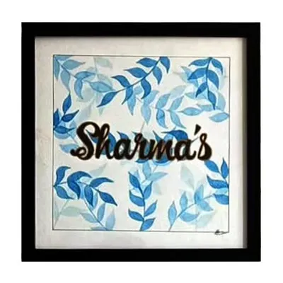 A custom watercolor nameplate for the Sharma family. I painted a pattern of delicate blue leaves to create a fresh, natural background for their family name, making it a warm and personal addition to their home.