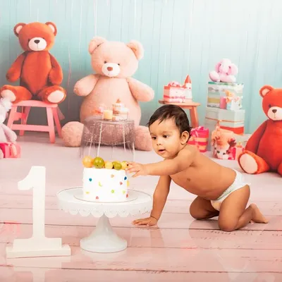 The moment of discovery during a first birthday cake smash. I capture every curious touch and sweet taste in these fun-filled studio sessions.