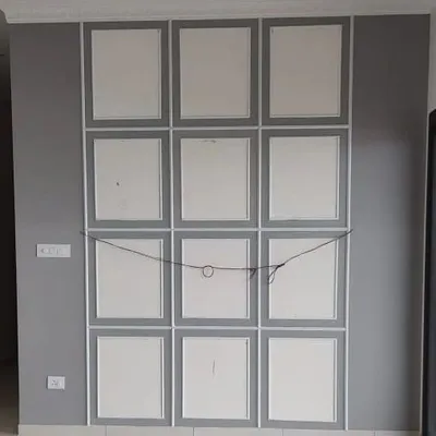 A gallery-style wall moulding design in progress, with multiple rectangular frames creating a classic and structured feature wall.