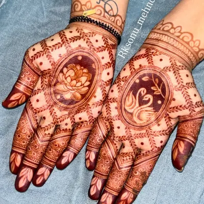 The beautiful result of my herbal henna paste. This photo shows the rich, dark stain of the lotus and swan design after the paste has been removed, a sign of pure, high-quality ingredients.