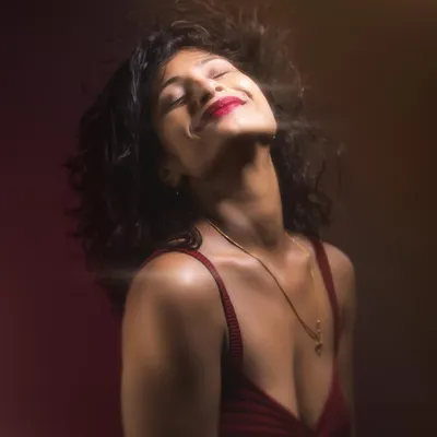 A dynamic studio portrait where we used lighting to freeze the motion of her hair. This kind of shot adds so much energy and life to a portrait session.