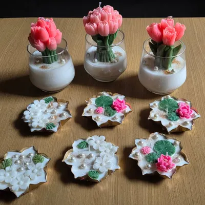 A stunning display of my sculptural candles. This image features my popular tulip bouquet candles alongside various floral-topped decorative candles.