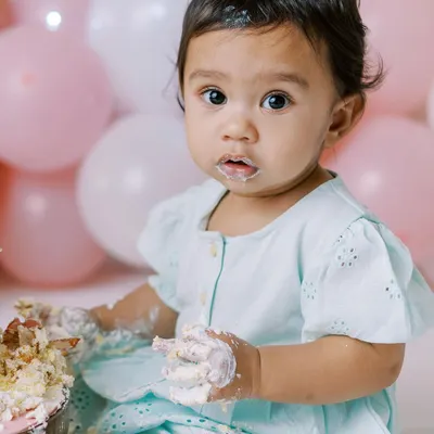 A cake smash is the perfect way to celebrate turning one. This little one is getting right into the spirit, and I'm here for every messy, happy moment. These sessions are all about your baby's unique personality.