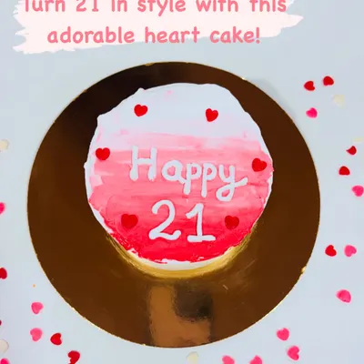 Celebrate turning 21 in style with this cute and classy minimalist cake. The design features a pink ombre watercolor effect and is dotted with tiny red hearts for a sweet, modern look.