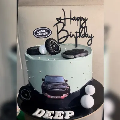 For the Land Rover Defender fan, this cake is the perfect tribute. It features the Land Rover logo, fondant tires, a key fob, and an edible image of the iconic vehicle, all on a sleek and modern cake.