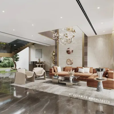 A wider perspective of the luxury family lounge, this view shows the relationship between different functional areas. The seating arrangement is oriented towards a double-height feature wall, while a sleek bar area is neatly tucked under the modern staircase, maintaining an open, airy feel.
