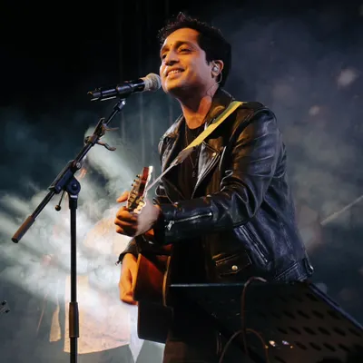A classic shot of Nikhil D'Souza with his guitar during a soulful performance at Impressions, COEP. He is one of the most sought-after indie artists for college festivals.