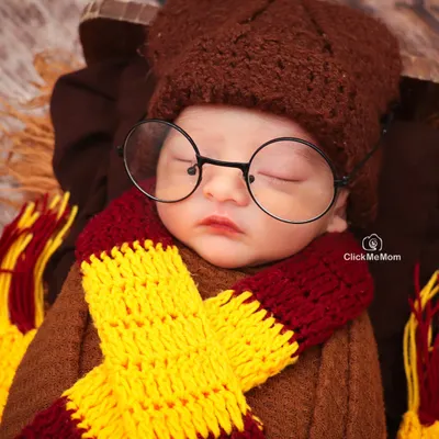 Mischief managed! This close-up of our little Harry Potter shows the adorable details of his themed costume, from the knitted scarf to the iconic round glasses.