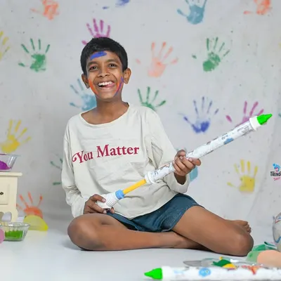 Holi is a festival of joy, and these photoshoots capture that perfectly. We use a colourful handprint backdrop and safe, vibrant powders for a fun and memorable session. It's even more fun when a furry friend joins in!
