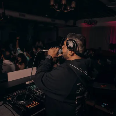 Getting on the mic is essential to my style. It's how I connect directly with the crowd, guide the energy, and make sure everyone feels like part of the show.