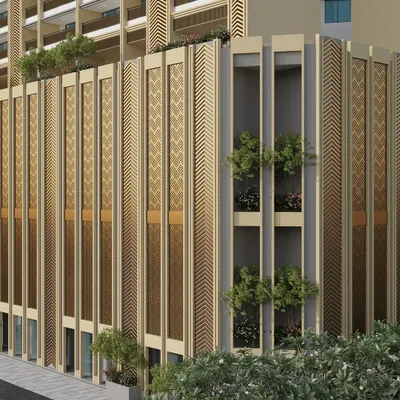 A close-up of the facade of our high-rise project in Mulund. This view highlights the detailed perforated screens and vertical elements that blend modern design with traditional patterns, creating a unique architectural texture.