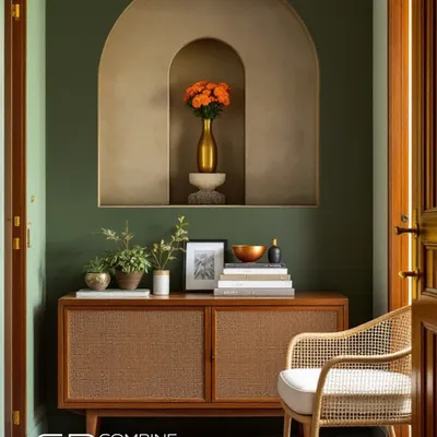The blend of natural rattan shutters and a soft, arched niche makes a beautiful statement in this entryway. The olive green wall provides a rich backdrop for the warm wood tones.