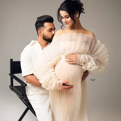 Pure serenity. This couple's portrait in coordinating white outfits is so angelic and peaceful. I love capturing the gentle affection between partners.
