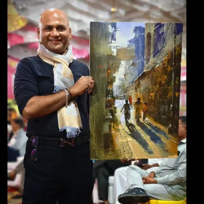 Holding my completed acrylic landscape painting after a live demonstration for the State Level Art Teachers' Art Council in Nandurbar.