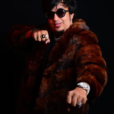 This look, with the fur coat and rings, is part of my personal brand. It reflects the "hustler" mindset of turning wounds into wisdom.
