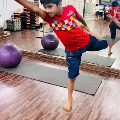 This young yogi shows amazing balance and focus in Natarajasana, the dancer's pose. Our kids' yoga classes are designed to build confidence and physical awareness.