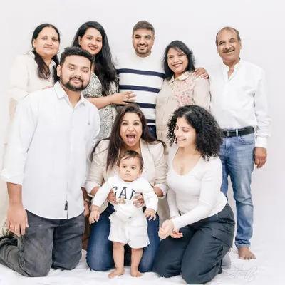 The whole 'khandaan' together. Capturing multiple generations in one frame, from the baby to the grandparents, creates a powerful and lasting legacy portrait for the entire family.