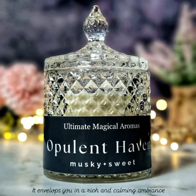 My luxurious Large Crystal Jar Candle in 'Opulent Haven'. This elegant masterpiece, with its musky and sweet notes, is designed to envelop you in a rich and calming ambiance.