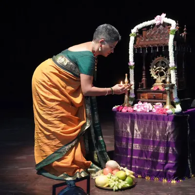 The sacred tradition of lighting the lamp before a performance. Here, I am at the debut recital of my dear student Ambili Krishnan, a moment filled with blessings and hope.