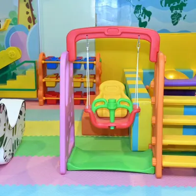 Our dedicated toddler area features this safe and fun swing and slide set. It's perfectly sized for little ones to enjoy and build their confidence.