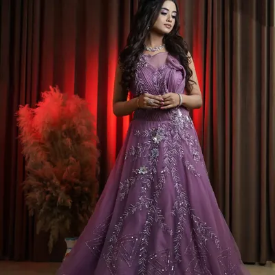 A full length view of our stunning onion pink bridal gown. The flowing tulle skirt and detailed bodice create a romantic and sophisticated look, ideal for capturing elegant reception or engagement photos for your portfolio.