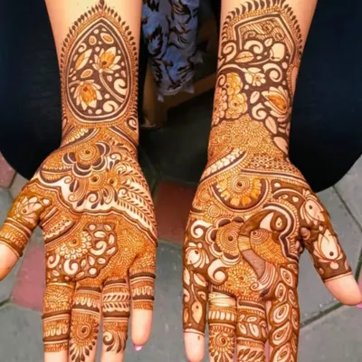 A beautiful example of an Arabic-Indian fusion design, with bold floral and paisley patterns on one hand and intricate peacock details on the other.