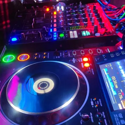 A close-up of my professional DJ gear, the heart of the party. I use industry-standard Pioneer CDJs and mixers to deliver crisp, clear sound and seamless transitions all night long.