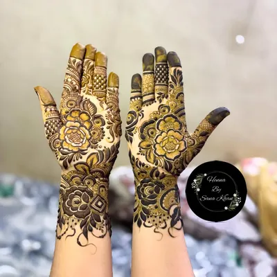 A stunning example of a full-coverage design where I've combined intricate floral work with detailed patterns on the fingers and wrist. The shading creates a beautiful depth, making the flowers pop.