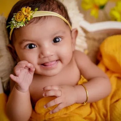 A smile as bright as the sun. I love using this cheerful yellow setup with sunflowers to capture the happiest expressions.