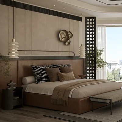 This spacious master bedroom combines a rich leather-finish bed with textured wall panels and a dramatic false ceiling. The design focuses on creating a luxurious yet comfortable atmosphere, with custom lighting and metallic art pieces adding a touch of modern sophistication.