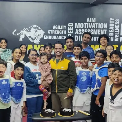 A group photo with my students and their parents celebrating our club's anniversary. The support from families is a huge part of our success at Panthers Combat Club.