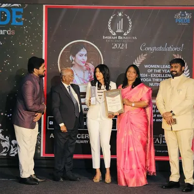 On stage receiving the 'Women Leader of the Year 2024' award for Excellence in Yoga Therapy & Nutrition. This recognition from the Indian Business Excellence Awards validates my holistic approach to wellness.