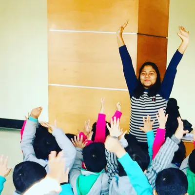 It's a beautiful sight to see so many hands reaching for the sky. In my group sessions, I focus on creating a space where children can move freely and joyfully together. This isn't about perfect poses, but about building stamina and coordination through playful, aerobic activities that leave everyone smiling.