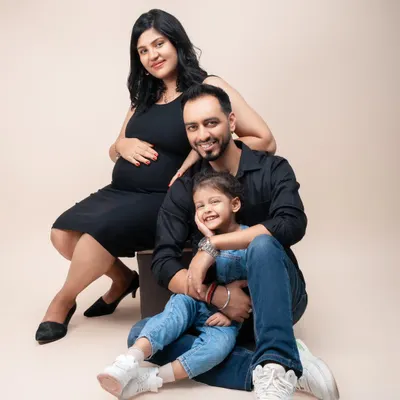 A beautiful family portrait, celebrating the expansion from three to four. The daughter's sweet smile shows her excitement to become a big sister. I love creating these classic, elegant portraits that the whole family will cherish.