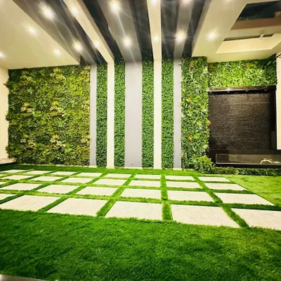 Our most ambitious indoor project, featuring a checkerboard floor of turf and tile, extensive vertical gardens, and modern ceiling design. This shows the transformative potential of artificial greenery indoors.