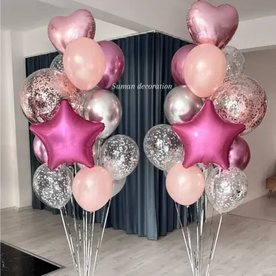 Two matching balloon bouquets perfect for flanking a doorway or cake table. These feature pink foil stars, confetti balloons, and chrome silver and pink latex balloons.