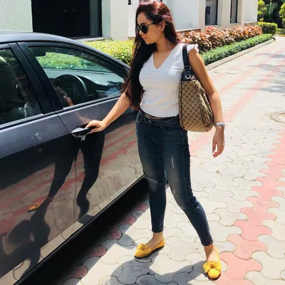 A classic white tee and jeans is a blank canvas. I elevated this simple look with a pop of color, using bright mustard loafers to add personality. It’s a simple color-blocking technique that makes a big impact.