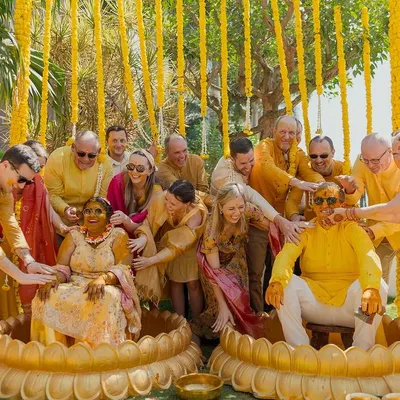 A moment of pure joy and cultural fusion at a Haldi ceremony. We created a fun and inclusive atmosphere where family and friends from across the globe could come together and celebrate, complete with traditional lotus-shaped seating for the couple.