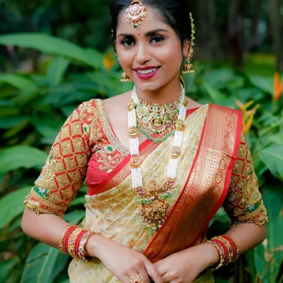 This is how I style a complete bridal look using my Jadau collection. We paired a multi-strand pearl and Jadau haara with a matching choker, maang tikka, and other accessories for a look that is both traditional and vibrant.