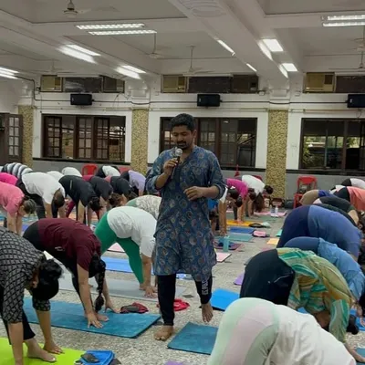 Our founder, Ajinkya Meher, leading a large group of practitioners during our International Yoga Day celebration.