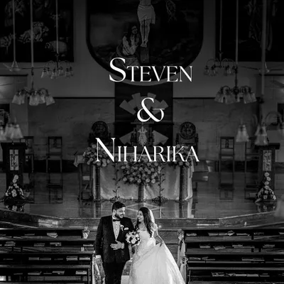 A classic black and white shot of the couple walking down the church aisle, a timeless memory.