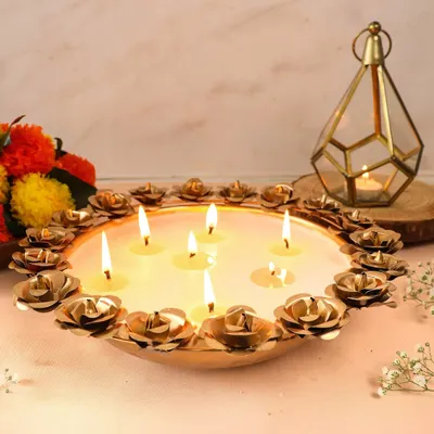 Our stunning Rose Urli candle bowl, featuring multiple wicks surrounded by delicate metal roses. This piece makes an epic centerpiece and a truly memorable gift for any celebration.