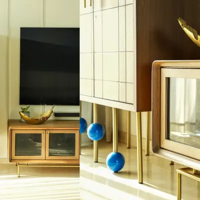 This artistic diptych highlights the unique details of modern furniture design. I juxtaposed the sleek wooden TV console with the playful, bold blue spheres on the cabinet legs, creating a visually interesting composition that draws attention to the craftsmanship.