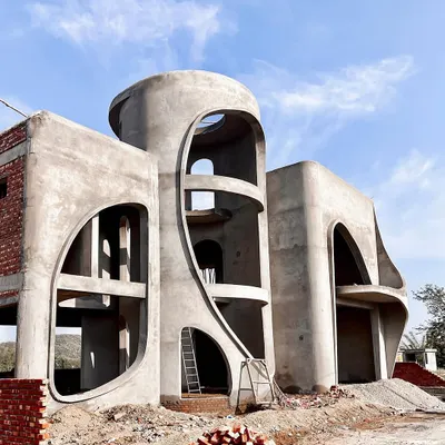The "La La Land" residence under construction. It's magical to see our vision of a fluid, hill-inspired structure blossoming from mere sketches into a tangible, living form.