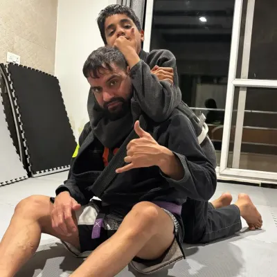 Training should be challenging but also build a positive mindset. Here, after a tough BJJ session at home, we see the results of hard work. I teach kids to be strong, respectful, and confident in their abilities.