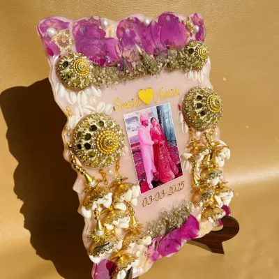 I preserved this bride's kalire and wedding flowers in a beautiful resin frame. It includes a photo and the wedding date, creating a unique piece of art from her special day.
