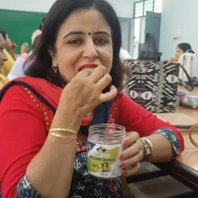 A happy customer enjoying our Chatpati Amla Candy straight from the jar. It's moments like these that make all the hard work in the kitchen worthwhile.