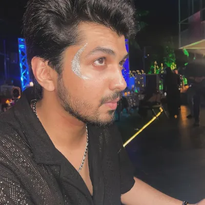 A clean and cool silver glitter crescent design for men. This shows how a simple touch of sparkle can elevate anyone's look for a party or music festival.