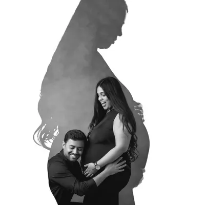 A creative black and white portrait using shadows and silhouettes. This artistic shot of a couple is a unique and powerful way to capture the moment.