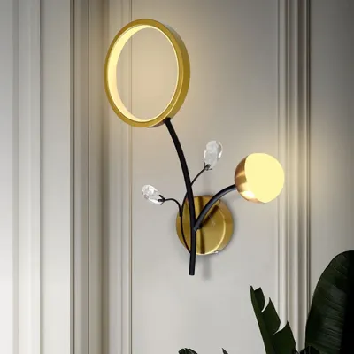 This floral-inspired wall light is a piece of art. It combines a ring light, a globe light, and crystal accents for a beautiful and unique design. It also features a three-color mode to suit your preference.
